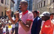 Expelled ANC councillor Loyiso Nkohla addresses the crowd outside the Western Cape High Court on 14 February 2014. Picture: Siyabonga Sesant/EWN