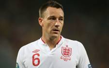 John Terry's defence for his racial slur towards Anton Ferdinand was "improbable, implausible and contrived."