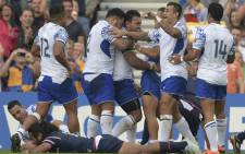 FILE: Samoan players celebrate after scoring a try during a Pool B match of the 2015 Rugby World Cup against the US on 20 September 2015. Picture: AFP.