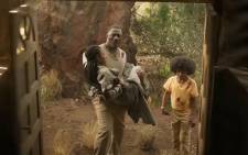 A screengrab of Idris Elba, Iyana Halley and Leah Jeffries in a scene from the movie 'Beast'.