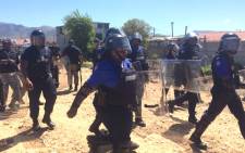 Metro Police officials armed with riot shields patrolled the area. Picture: Lauren Isaacs/EWN.