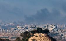 A picture taken from southern Israel near the border with the Gaza Strip on December 2, 2023, shows smoke billowing over the Palestinian territory during Israeli bombardment amid continuing battles between Israel and the militant group Hamas. Picture: JACK GUEZ /AFP
