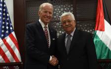 FILE: US Vice-president Joe Biden and Palestinian President Mahmud Abbas shake hands following a meeting at the presidential compound in the city of Ramallah, in the West Bank, on 9 March, 2016. Picture: AFP.