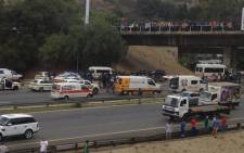 A picture taken from Killarney Mall shows police and paramedics on the M1 highway after a shootout on 22 October 2013. Picture: via Twitter @footballmurph