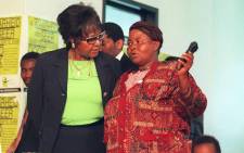 Winnie Madikizela-Mandela (left) with Joyce Seipei, mother of murdered child activist Stompie Seipei, at the Truth and Reconciliation Commission (TRC) hearings in Johannesburg on 4 December 1997. Picture: AFP.