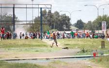Protesters in Zamdela township in Sasolburg on 22 January 2013 had a stand off against the police. Picture: Sebabatso Mosamo/EWN