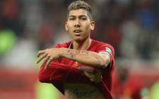 FILE: Liverpool's Brazilian midfielder Roberto Firmino celebrates his winning goal during the 2019 FIFA Club World Cup semi-final football match between Mexico's Monterrey and England's Liverpool at the Khalifa International Stadium in the Qatari capital Doha on 18 December 2019. Picture: AFP. 