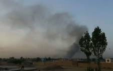 This screen grab taken from AFPTV video on 10 August 2018 shows smoke rising into the air after Taliban militants launched an attack on the Afghan provincial capital Ghazni. Picture: AFP