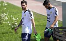 Argentina's forward Lionel Messi (C) and forward Sergio Aguero arrive for a training session at the team's base camp in Bronnitsy, on 23 June 2018, during Russia 2018 World Cup football tournament. Picture: AFP