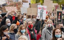 Demonstrators protest with banners and placards against tightening Poland's already restrictive abortion law in Warsaw on 28 October 2020. Picture: AFP.