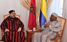 This handout picture provided by the Moroccan Royal Palace on 3 December, 2018 shows Morocco's King Mohamed VI (L) visiting Gabon's President Ali Bongo at the military hospital in the capital Rabat. Picture: AFP