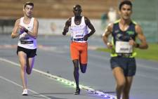 Ugandan athlete Joshua Cheptegei (C) competes in the men's 10,000m event during the NN Valencia World Record Day at the Turia stadium in Valencia on 7 October 2020. Cheptegei set a new men's 10,000m world record of 26 minutes 11 seconds in event. Picture: AFP