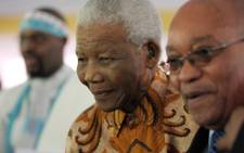 FILE: President Jacob Zuma with former president Nelson Mandela. Picture: AFP