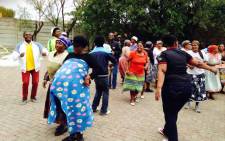 Some Marlboro residents sat outside the community hall singing and dancing, calling for officials to give them reasons why they have been evicted in the area on 23 March 2015. Picture: Masego Rahlaga/EWN.