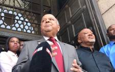 Outgoing Finance Minister Pravin Gordhan and Deputy Finance Minister Mcebisi Jonas speak outside Treasury after being axed in a Cabinet reshuffle. Picture: Barry Bateman/EWN