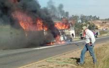 Learners were rescued from a bus before is burst into flames after a motorbike crashed into it on the N2 near Grabouw. Picture: Kenny Afrika