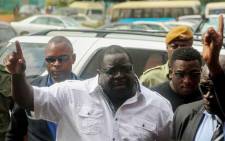 FILE: Former Zambian minister and a leading critic of President Edgar Lungu, Chishimba Kambwili, gestures while arriving at the Lusaka Magistrates Court Complex on 28 March 2018 to stand a trial on charges of profiting from the proceeds of crime. Picture: AFP