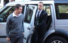 Oscar Pistorius enters the High Court in Pretoria ahead of his murder trial on 12 May 2014. Picture: Christa Eybers/EWN.