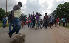 Angry protesters block the main route to Zimbabwe's capital Harare from Epworth township on 14 January 2019. Picture: AFP