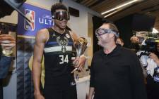 Giannis Antetokounmpo #34 of the Milwaukee Bucks talks to Head Coach Mike Budenholzer of the Milwaukee Bucks after defeating the Phoenix Suns in Game Six to win the 2021 NBA Finals on 20 July 2021. Picture: AFP