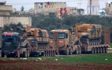 Turkish military vehicles are pictured in the town of Binnish in Syria’s northwestern province of Idlib, near the Syria-Turkey border on 12 February 2020. Picture: AFP. 
