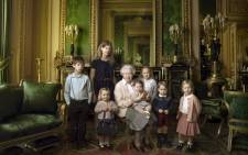 This handout portrait picture taken by US photographer Annie Liebovitz shows Queen Elizabeth II (C) posing with her two grandchildren, James, Viscount Severn (L) and Lady Louise (2L) and her five great-grandchildren Mia Tindall (holding handbag), Savannah Philipps (3R), Isla Phillips (R), Prince George (2R) and Princess Charlotte (C) in the Green Drawing room at Windsor Castle in Windsor. Picture: AFP.