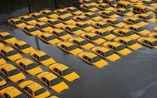 A parking lot with cabs in New Jersey is left flooded after Superstorm Sandy hit the area on 30 October 2012. Picture: Twitter