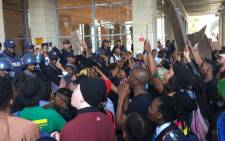 Protesters against gender-based violence clash with police at the Cape Town International Convention Centre on 4 September 2019.  Picture: EWN
