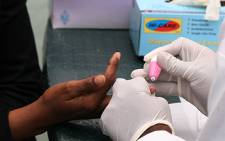 A nurse takes an HIV test at a voluntary testing centre. Picture: EWN