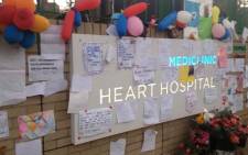 Flowers and messages of well wishes posted on the wall at Mediclinic Heart Hospital in Pretoria where the former Preseident Nelson Mnadela is receiving treatment. Picture:EWN