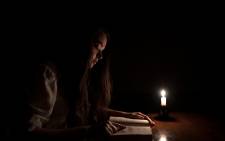 Picture: Studying for an exam during loadshedding. © alexcsabo/123rf.com