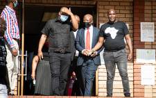 EFF leader Julius Malema (in red tie) at the Randburg Magistrates court on 28 October 2020 where he and EFF MP Mbuyiseni Ndlozi are on trial for allegedly assaulting a police officer in 2018. Picture: Xanderleigh Dookey/EWN.