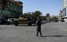 Afghan security personnel stand guard near the site of a suicide attack that targeted a Shiite mosque in Kabul on 25 August 2017. Picture: AFP
