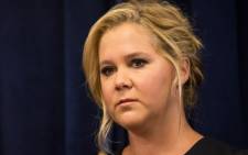Comedian Amy Schumer speaks at a press conference with US Senator Chuck Schumer calling for tighter gun laws in an effort to stop mass shootings and gun violence on 3 August 2015 in New York City. Picture: AFP.