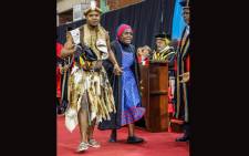 Appreciation at its best: UKZN Bachelor of Laws graduate Njabulo Ntombela takes his great-grandmother to accept the hood on his behalf. Picture: UZKN.