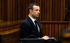 FILE: Oscar Pistorius listens to a witness testifying at the High Court in Pretoria on 10 March 2014. Picture: Pool