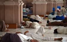 FILE: Pakistani Muslims rest at a mosque during a heatwave in Karachi on 22 June 2015. Picture: AFP