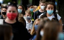 FILE: Children wearing protective face masks arrive at school on 7 September 2020 in Zagreb. School started in Croatia today with the implementation of epidemiological measures to combat the coronavirus pandemic. Picture: AFP.
