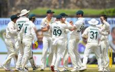 Australia's players celebrate after the dismissal of Sri Lanka's Oshada Piyumal Fernando (not pictured) during the third day of first cricket Test match between Sri Lanka and Australia at the Galle International Cricket Stadium in Galle on 1 July 2022. Picture: ISHARA S. KODIKARA / AFP