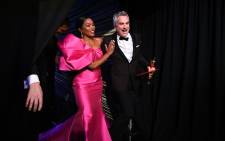 This handout photo released by A.M.P.A.S. shows Best Foreign Language Film winner for 'Roma' Mexican director Alfonso Cuaron (R) walking with US actress Angela Bassett backstage during the 91st Annual Academy Awards at the Dolby Theatre in Hollywood, California on 24 February 2019. Picture: AFP