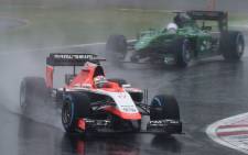 FILE:Marussia driver Jules Bianchi (front) of France leads Caterham driver Kamui Kobayashi of Japan at the Formula One Japanese Grand Prix in Suzuka on 5 October, 2014. Picture: AFP