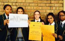 Students from Kingsmead College in Johannesburghold up anti-xenophobic placards. Picture: @Palie_Mogodi via Twitter