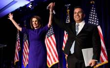 House Minority Leader Nancy Pelosi (D-CA) and Representative Ben Ray Lujan (D-MN), DCCC Chairman, celebrate a projected Democratic Party takeover of the House of Representatives during a midterm election night party hosted by the Democratic Congressional Campaign Committee on 7 November 2018 in Washington, DC. Picture: AFP