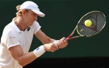 South Africa's Kevin Anderson returns against US player John Isner during their men's singles semi-final match on the eleventh day of the 2018 Wimbledon Championships at The All England Lawn Tennis Club in Wimbledon, southwest London, on 13 July  2018. Picture: AFP.