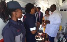 Gauteng premier David Makhura inspects one of the 82 new ambulances handed over to the provincial health department. Picture: Vumani Mkhize/EWN. 