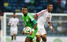 Congolese Thievy Bifouma (L) vies for the ball with Nigeria's Ogenyi Onazi during the 2015 African Cup of Nations qualifying football match between Nigeria and Congo Brazzaville on 6 September, 2014. Picture: AFP.