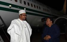 Nigerian President Muhammadu Buhari (L) arrives in South Africa on 2 October 2019 at Waterkloof Air Force Base in Tshwane for a state visit. Buhari was met by International Relations and Cooperation Minister Naledi Pandor. Picture: @DIRCO_ZA/Twitter. 