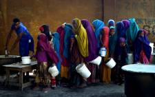 A severe drought is threatening famine in Somalia, where the UN estimates 5.5 million people at risk. Young girls line up at a feeding centre in Mogadishu. Picture: United Nations Photo