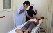 An Afghan wounded boy receives treatment at a hospital following multiple explosions in Jalalabad on 11 September 2018. Picture: AFP