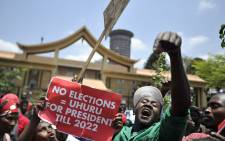 FILE: Supporters of President Uhuru Kenyatta-led Jubilee Alliance shout slogans during a demonstration on 19 September 2017 outside the Supreme Court of Kenya in Nairobi. Picture: AFP